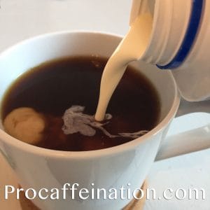 cream pouring into coffee